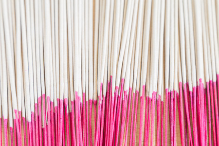 Close up picture of incense sticks use for worship in Buddhism and Hinduism in Asia.の写真素材