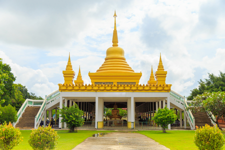 Pagoda on roof top in Buddhist Temple with clouds and blue sky in Thailand.のeditorial素材