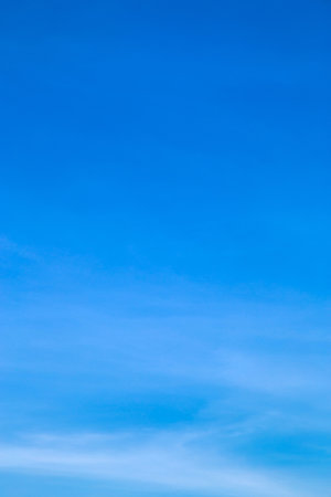 Vertical image white clouds in blue sky in the morning.の写真素材