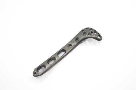 A Sleek titanium alloy Tibial Plateau Lateral surgical implant with multiple holes for fixation and stabilityの写真素材