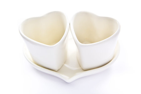 white love coffee cups for valentines day isolated on white background の写真素材