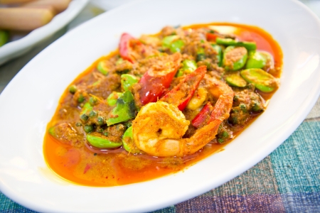 prawn in spicy curry on white plate の写真素材