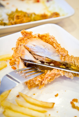 fried chicken drumsticks with french friesの写真素材