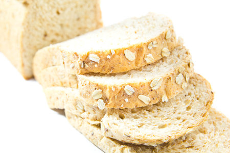 Slices of finest organic bread on white background, isolated