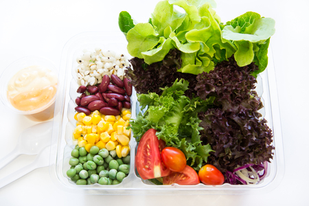 take away salads on white. Includes green salad, garden salad, greek salad and ingredientsの写真素材