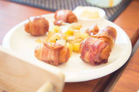 Bacon roll with sausageの写真素材