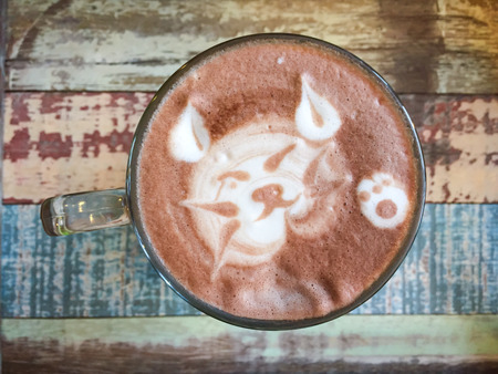 Cat shape of latte art coffee on wooden backgroundの写真素材