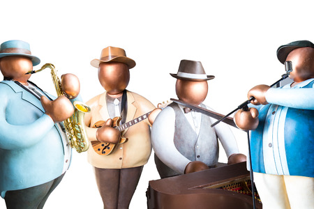 Fat man toy band playing saxophone , guitar and piano instruments with singer on white background isolatedの写真素材