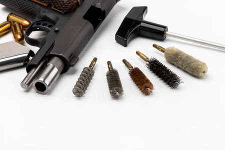 Set of brush Cleaning Bore of pistol handgun on white background , Gun Maintenanceの写真素材