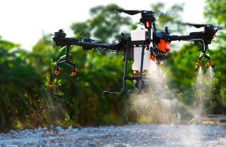 Agriculture drone fly to sprayed fertilizer on the fieldsの写真素材