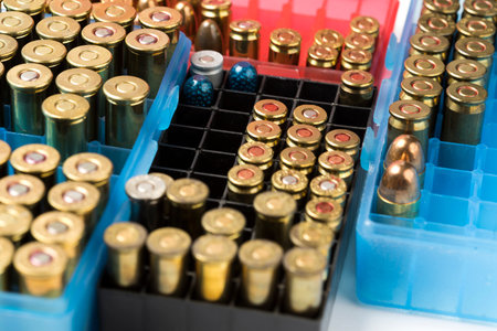 Ammunition of different sizes in the box for the background