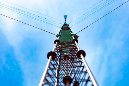 Communication antenna tower with blue sky background