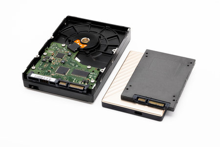Hard disk and ssd disk (solid state drive) on white background , size comparison of hard disk