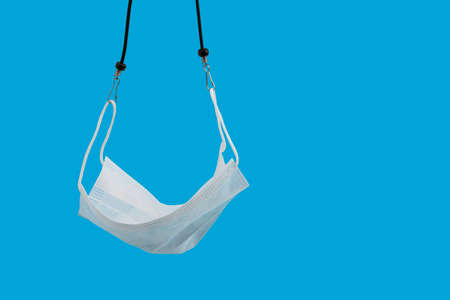 Face mask on isolated color background , Everyday carry essentials of Covid-19 pandemicの写真素材