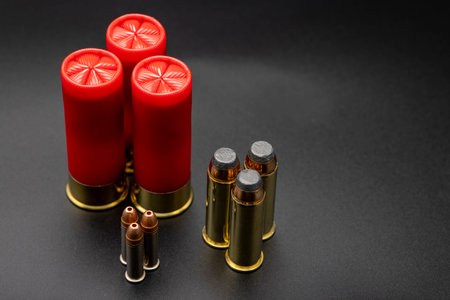 Ammunition of different sizes on black background