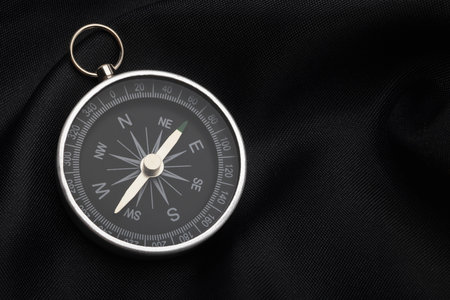 Compass, navigational compass on black backgroundの写真素材