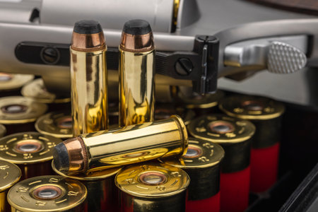 Close up of .44 magnum bullet and revolver hand gun background