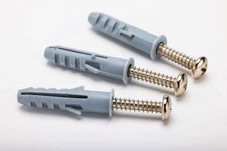 Plastic anchor bolts on white background , Equipment for construction