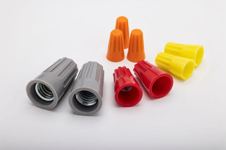 Different sizes and colors of Wire nuts on white background , Tool for connecting electrical wires