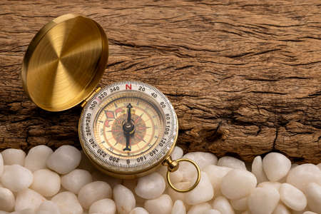 Vintage compass, navigational compass on wooden backgroundの写真素材