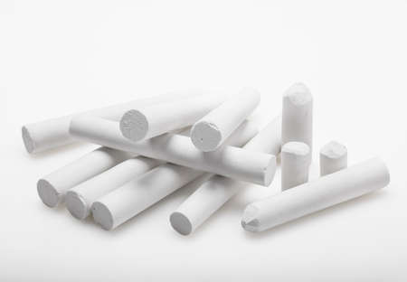 Pile of white chalk on white backgroundの写真素材