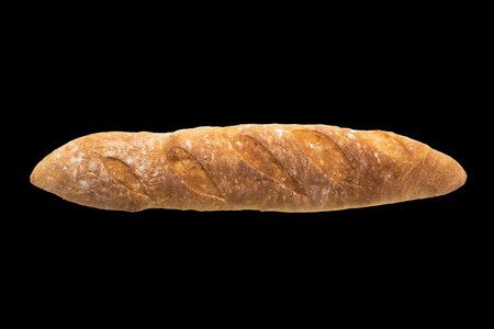 French freshly baked baguette isolated on black background , top view