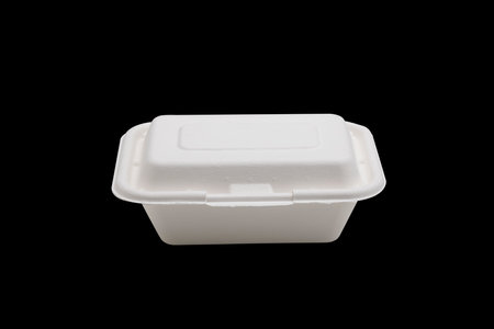 Bagasse food box on black isolated background , Natural eco-friendly disposable utensil conceptの写真素材