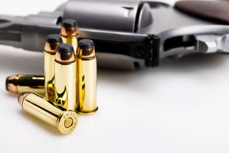 .44 magnum bullets with revolver hand gun backgroundの写真素材