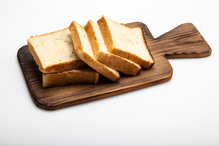 Fresh homemade  sliced bread on   wooden cutting board backgroundの写真素材