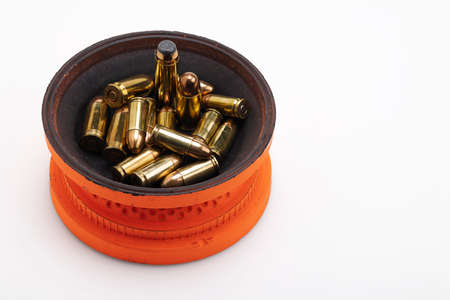 Clay shooting target and gun bullets on white backgroundの写真素材