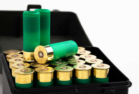 12 gauge , Green shotgun shell in bullet box on white backgroundの写真素材