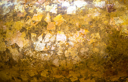 Shiny yellow gold leaf foil surface, can be used as a backgroundの写真素材