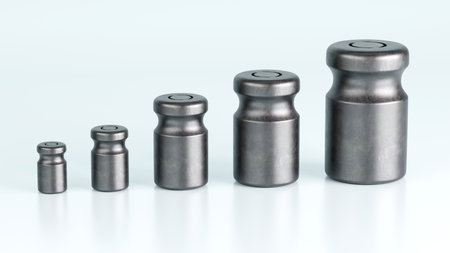 3D rendering of different size of metal calibration weight on color backgroundの写真素材