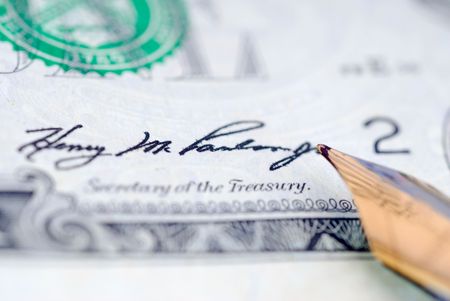 Handwriting banknote. Signing a dollar black inkの写真素材