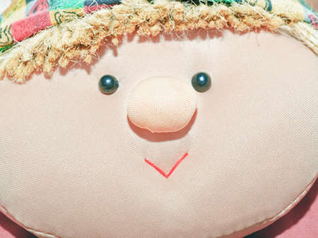 Rag doll. The toy of fabric, glass eyesの写真素材