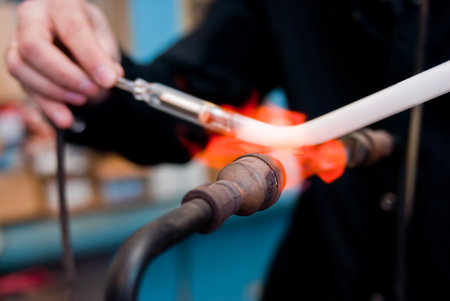 Glass tube to neon- gas burnerの写真素材