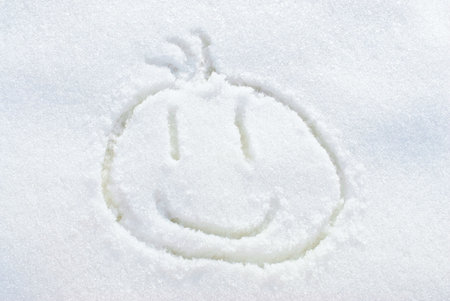 Smiley- face funny man in the snowの写真素材