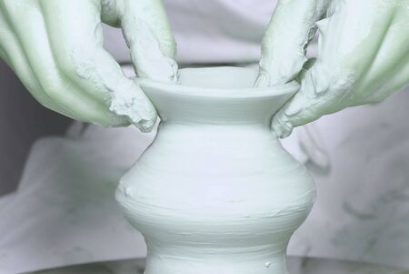 Potter's wheel. Making dishes from clayの写真素材