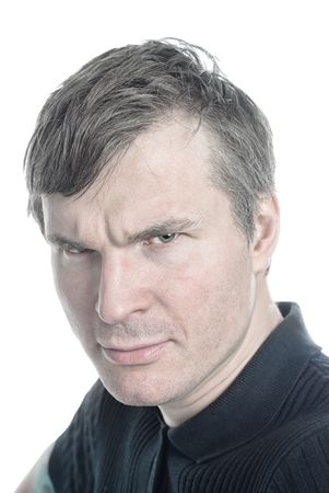 Gray-haired man, an angry glance from beneath his eyebrowsの写真素材