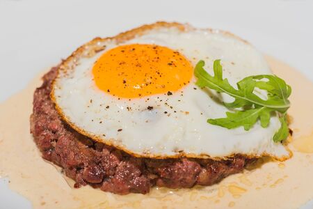 Fried eggs and steak- parsley decoration の写真素材
