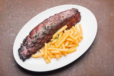 Fried meat and greens lying on a platter