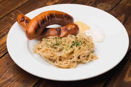 grilled sausages and sausage on a plateの写真素材