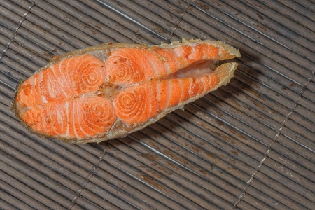 Baked salmon on a bamboo matの写真素材