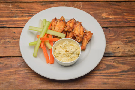 Meat salad in a bowl on wooden tableの写真素材