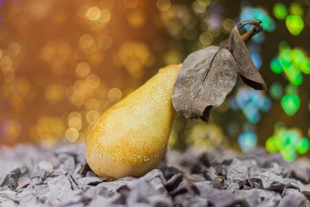 Pear lying on the rocks  Blurred focus lensの写真素材