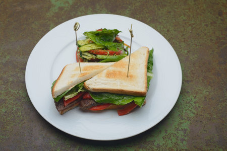 sandwich with greens and meatの写真素材