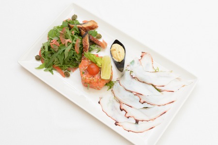 seafood salad lies on a plateの写真素材