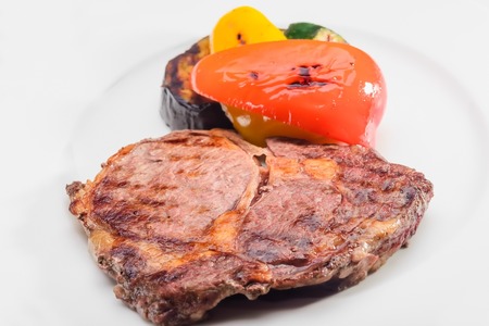 roasted meat on the coals with vegetablesの写真素材