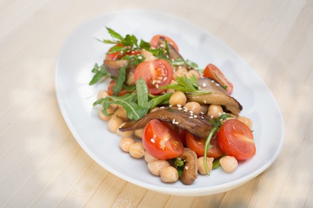 Salad of tomatoes olives slices of cheeseの写真素材