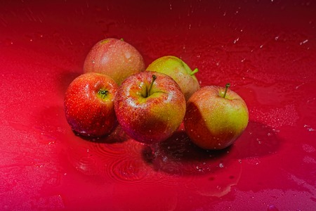 ripe apples are washed with waterの写真素材